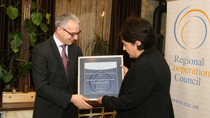 Director of the South East European Centre for Entrepreneurial Learning (SEECEL), Efka Heder, on behalf of her organisation, receives RCC's Champion of Regional Cooperation award for 2013 from RCC Secretary General, Goran Svilanović, in Sarajevo, BiH on 27 February 2014 . (Photo: RCC/Zoran Kanlic)