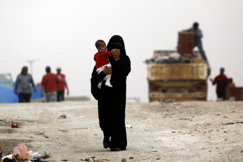 Photo: Displaced Syrians who fled the Islamic State's capital of Raqqa before it fell to Syrian forces are housed in Ain Issa, a camp north of the city | Delil Souleiman/AFP via Getty Images