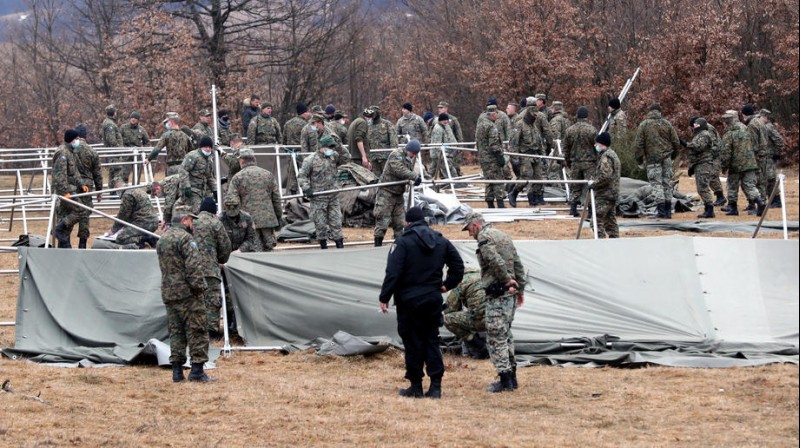 Bosnian soldiers set up new tents for migrants at the Lipa camp in Bihac, Bosnia and Herzegovina, 01 January 2021. [EPA-EFE/FEHIM DEMIR]