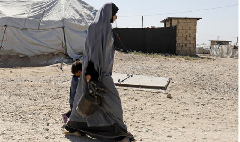 A woman and child in a Kurdish detention camp for ISIS suspects (Image: GETTY)