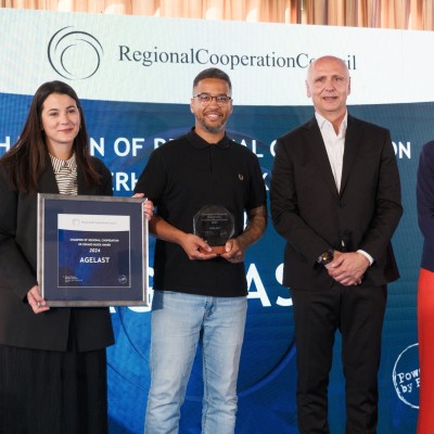 RCC Secretary General Amer Kapetanovic and Austrian Ambassador to Albania, Monika Zach with winners of Champion of Regional Cooperation Dr Erhard Busek Award for year 2024 - Agelast podcast - at the ceremony held in Tirana on 15 June 2025 (Photo: RCC/Armand Habazaj) 