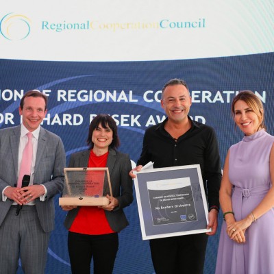 RCC Secretary General Majlinda Bregu and Deputy Director for General European Matters at Federal Ministry for European and International affairs Thomas Stoelezl with the Members of No Border Ocherstra at the Champion of Regional Cooperation dr. Erhard Busek ceremony in Budva on 05 June 2023 (Photo: Armand Habazaj)