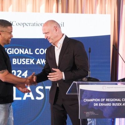 RCC Secretary General Amer Kapetanovic with Galeb Nikacevic on behalf of the Agelast podcast, the winner of the Champion of Regional Cooperation Dr Erhard Busek Award for year 2024 at the ceremony held on 15 June 2025 in Tirana (Photo: RCC/Armand Habazaj)