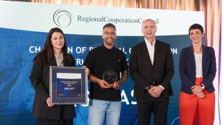 RCC Secretary General Amer Kapetanovic and Austrian Ambassador to Albania, Monika Zach with winners of Champion of Regional Cooperation Dr Erhard Busek Award for year 2024 - Agelast podcast - at the ceremony held in Tirana on 15 June 2025 (Photo: RCC/Armand Habazaj) 
