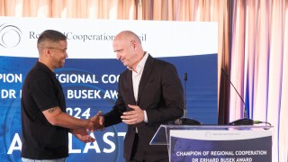 RCC Secretary General Amer Kapetanovic with Galeb Nikacevic on behalf of the Agelast podcast, the winner of the Champion of Regional Cooperation Dr Erhard Busek Award for year 2024 at the ceremony held on 15 June 2025 in Tirana (Photo: RCC/Armand Habazaj)
